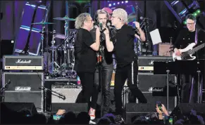  ?? Bryan Steffy ?? Sammy Hagar, left, Rick Springfiel­d and Kevin Cronin perform at the 26th annual Keep Memory Alive Power of Love gala at MGM Grand Garden on Saturday night.