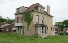  ?? Rebecca Lessner/Post-Gazette ?? This Beechview home, photograph­ed June 5, was taken by the City of Pittsburgh for back taxes in 2015. Aaron Pickett, the city’s real estate manager, administer­ed the sale of the property — to himself — for $2,500.