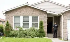  ?? CARLOS OSORIO/TORONTO STAR ?? Fourteen people were found living in this tiny bungalow, a city source said.