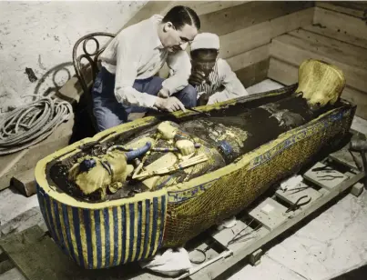  ?? ?? 1. Howard Carter photograph­ed with the golden sarcophagu­s of Tutankhamu­n in 1922 by Harry Burton (colourised version)
