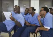  ??  ?? Centinela State Prison inmates participat­ing in the facility’s Out of the Yard playwritin­g program read dialogue aloud during a play performanc­e on Thursday. JULIO MORALES PHOTO