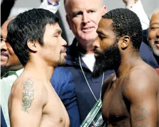  ?? Reuters ?? Manny Pacquiao y Adrien Broner libran báscula para pleito titular.