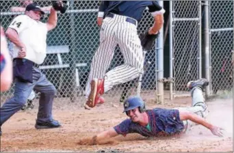  ?? PETE BANNAN — DIGITAL FIRST MEDIA ?? Concord’s Cole Gamber scores with a belly slide as Wayne pitcher Josh Rickards tries to grab a throw. The play, which started on a third strike passed ball, produced Concord’s only run, but Wayne and Rickards would register a 2-1 victory at Radnor High...