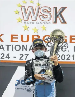  ??  ?? Jamaica’s Alex Powell hoists his trophy after winning the final leg of the WSK Euro Series in Sarno, Italy, recently.
