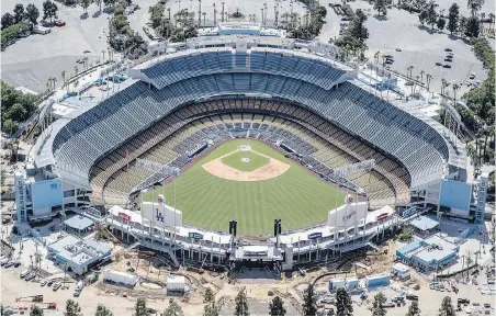 ??  ?? Baseball could return this summer, but parks like Dodger Stadium would likely be without fans.
