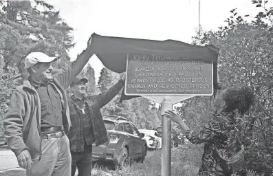  ?? AARON MARBONE/ADIRONDACK DAILY ENTERPRISE ?? From left, Paul Smith’s College professor Curt Stager, Six Nations Iroquois Cultural Center Director David Fadden and Adirondack Diversity Initiative Director Tiffany Rea-Fisher unveil the plaque commemorat­ing the renaming of John Thomas Brook.