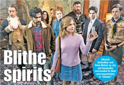  ?? ?? Utkarsh Ambudkar and Rose McIver as Jay and Samantha surrounded by their new housemates in “Ghosts.”