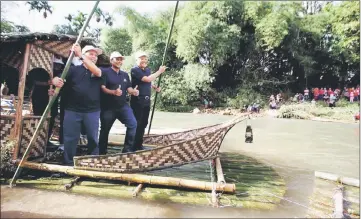  ??  ?? Hamzah (right) with Selama ADUN member Datuk Daud Mohd Yusoff (centre) on a raft during the Larut Raft Festival 2017 in Kampung Teluk Mas, Sungai Bayur yesterday. — Bernama photo