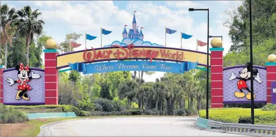  ?? JOE BURBANK/TNS ?? An empty entrance to Walt Disney World on March 24. The NBA is using the ESPN Wide World of Sports Complex at Disney World as a venue to complete the season.