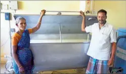  ??  ?? Dairy farmers at a milk procuremen­t centre with a rapid chiller facility in a Tamil Nadu village.