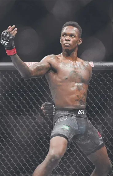  ?? Picture: AP ?? PATIENT: Israel Adesanya waited for his moment against Brazil's Anderson Silva, and dominated the third round of their middleweig­ht bout in Melbourne.
