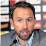  ??  ?? HELPFUL Southgate will give Oxlade some time
