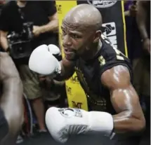  ?? ASSOCIATED PRESS FILE PHOTO ?? Saturday’s fight between Floyd Mayweather Jr., pictured, and Conor McGregor has little to do with real boxing, say pugilist purists. If McGregor had boxed before it may have added credibilit­y.