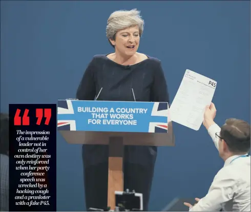  ??  ?? Comedian Simon Brodkin, also known as Lee Nelson, confronts Prime Minister Theresa May during her keynote speech at the Conservati­ve Party Conference.