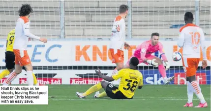  ??  ?? Niall Ennis slips as he shoots, leaving Blackpool keeper Chris Maxwell with an easy save.