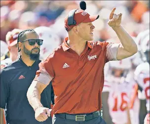  ?? AP ?? GREAT SCOTT! Nebraska head coach Scott Frost, three-point underdogs to Michigan, has his team trending upward after a blowout win against Northweste­rn.