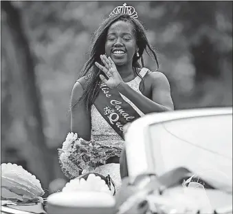  ??  ?? Keji Latio, the 2016 Miss Canal Winchester, appears in the festival parade.