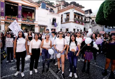  ?? PHOTO: AP ?? People in Taxco, Mexico, on Thursday chant “justice” during a protest over the kidnapping and killing of an eight-year-old girl.