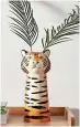  ?? ?? Ceramic tiger head vase, £15, Dunelm
Whether you opt for fresh blooms, dried flowers or a faux fern, this ceramic tiger vase is a vision of loveliness.