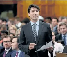  ?? SEAN KILPATRICK/THE CANADIAN PRESS ?? Prime Minister Justin Trudeau stands during question period in the House of Commons on on Wednesday. Trudeau shot down a parliament­ary committee’s recommenda­tion, Thursday, that Ottawa impose a five per cent tax on broadband Internet services as a way...