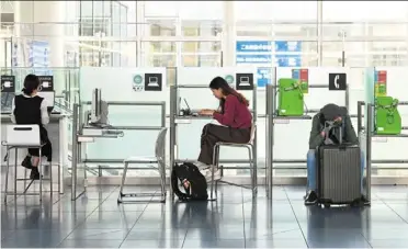  ?? — Bloomberg ?? Travellers at a departure hall at Haneda airport, said to be the world’s cleanest airport in 2024.