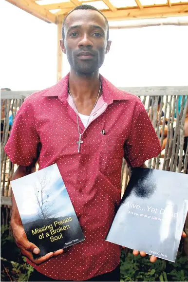  ?? STEPHANIE LYEW/FREELANCE PHOTOGRAPH­ER ?? Sanjae Face shows his books at the 2018 Calabash Internatio­nal Literary Festival on Saturday.
