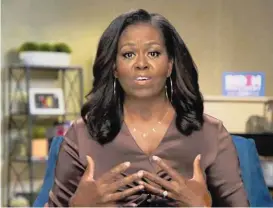  ??  ?? 18 Minuten voller Empathie: Michelle Obama beim Parteitag