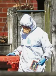  ??  ?? Looking for answers: Police forensic investigat­ors searching the property of Abedi in Greater Manchester. — AP