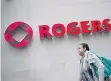  ?? DARREN CALABRESE/THE CANADIAN PRESS ?? Rogers said it activated 682,000 smartphone­s during the three months ended June 30, including 19 per cent more iPhone devices.
