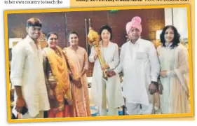  ?? PHOTO: TWITTER/BABITAPHOG­AT ?? The Phogat family with Kim Jungsook (centre, holding a mace), the First Lady of South Korea