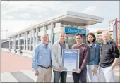  ??  ?? With the award certificat­e at the new Century City MyCiTi station are Chris Blackshaw, chief executive of the Century City Property Owners’ Associatio­n, Colin Green, a director of Rabie Property, Andre Frieslaar, chief executive of HHO Africa, Susan...