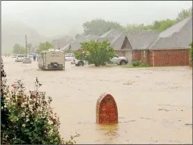  ?? (Courtesy Photo) ?? The end of Rosebay Lane looking up the street toward Garland McKee Road is pictured above following a major rain event that occurred in April 2017 in Farmington. Almost all the houses on the south side of Rosebay Lane flooded. Washington County received 8 to 9 inches of rain over two days, according to the National Weather Service.