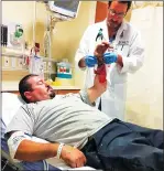  ?? Jabbott@appealdemo­crat.com Courtesy photo ?? Victor Torres is treated for injuries he suffered during a dog attack on Simpson Lane Tuesday evening. Torres said he intervened during the incident after he saw two other people being attacked by two pit bulls.