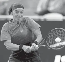  ?? ELSA/GETTY IMAGES ?? Anhelina Kalinina of the Ukraine returns a shot to Caroline Wozniacki of Denmark on Day 3 of the WTA 500 Credit One Charleston Open 2024 at Credit One Stadium on Wednesday.