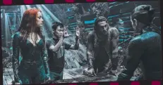  ??  ?? Thor: Ragnarok’s Chris Hemsworth (Thor); on the Gold Coast set of film Aquaman, James Wan (second from left) directs actors Amber Heard (as Mera), Jason Momoa (Aquaman/Arthur Curry) and Willem Dafoe (back to camera, as Aquaman’s mentor Vulko) inside a sunken Spanish galleon; Blake Lively in a scene from The Shallows.