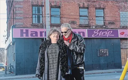  ?? GARY YOKOYAMA THE HAMILTON SPECTATOR ?? LA (LaurelAnn) and Ed Prociuk stand in front of Hamilton Strip. Prociuk, 70, is retiring after 40 years of waiting tables and bartending at the strip club, formerly Hanrahan’s. He says the city once had 13 strip clubs but is now down to just one, and it won’t be issuing any more licences.