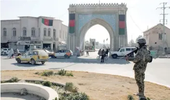  ?? — Reuters ?? An Afghan National Army soldier stands guard near the Kandahar governor guest house building where a bomb blast took place.