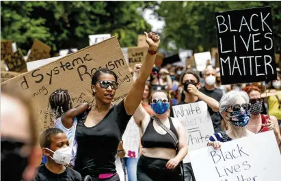  ?? BOB ANDRES / BANDRES@AJC.COM ?? On a day that would have been the start of Summerfest, canceled due to the pandemic, about 1,000 protesters marched down Virginia Avenue to Piedmont Park on Saturday, where they planned to join with other protest groups.