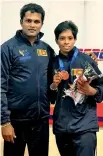  ??  ?? Nadeeka Ranasinghe with the Best Boxer trophy at the Nationals.