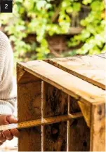  ??  ?? 2 2. The depth inside the crate is measured. Two batons of wood are marked with pencil and cut to length.