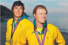  ?? Picture: BRAD FLEET ?? GLORY DAYS: Iain Jensen and Nathan Outteridge with their gold medals at the London Games.