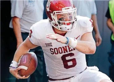  ?? [PHOTOS BY SARAH PHIPPS, THE OKLAHOMAN] ?? Oklahoma quarterbac­k Baker Mayfield staked his claim to the Heisman Trophy with his performanc­e in Bedlam. His play this season is solidifyin­g a top spot in next spring’s NFL Draft, too.