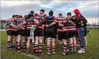  ??  ?? Enniscorth­y gather in a huddle after securing their place in the Towns Cup quarter-final.