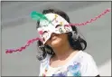  ?? KARL MONDON — STAFF PHOTOGRAPH­ER ?? Issey Maldonado, 6, proudly wears her self-made Mardi Gras mask at the Mini Maker Faire at History Park in San Jose.