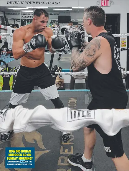  ?? Picture: SUPPLIED ?? Rohan Murdock works with trainer Chris Carden at Corpus Christi Boxing Club.