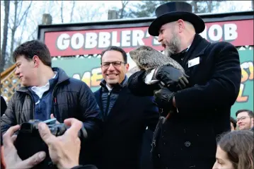  ?? (Larry McGuire, Punxsutawn­eyspirt) ?? Groundhog see’s Shadow, 6 more weeks of winter predicted.