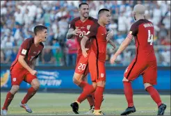  ?? AP PHOTO REBECCA BLACKWELL ?? United States’ Bobby Wood, second right, celebrates with teammates after scoring his team’s first goal during a 2018 World Cup qualifying soccer match against Honduras in San Pedro Sula, Honduras, Tuesday. The match ended in a 1-1 tie.