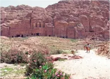  ??  ?? Photo shows camels against a panorama of the Royal Tombs in the ancient city of Petra, Jordan.