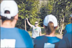  ?? DUKE ENERGY ?? Emily Wood leads a planting demonstrat­ion to a group of Duke Energy volunteers. Wood is currently the Executive Director of the Indiana Wildlife Federation.