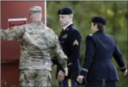  ?? GERRY BROOME - THE ASSOCIATED PRESS ?? Army Sgt. Bowe Bergdahl, center, arrives at the Fort Bragg courtroom facility for a sentencing hearing at Fort Bragg, N.C., Friday. Bergdahl, who walked off his base in Afghanista­n in 2009 and was held by the Taliban for five years, pleaded guilty to...